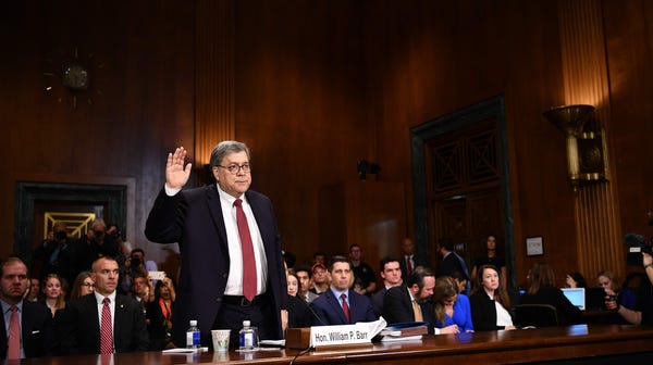 U.S. Attorney General William Barr is sworn in...