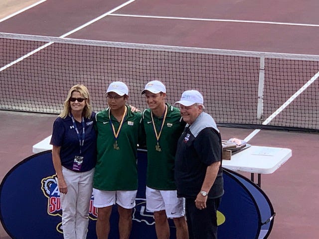 Menard tennis duo Justin Urbi (second left) and Anderson Dewitt (second right) won the Division III doubles title at the LHSAA tennis tournament April 27.