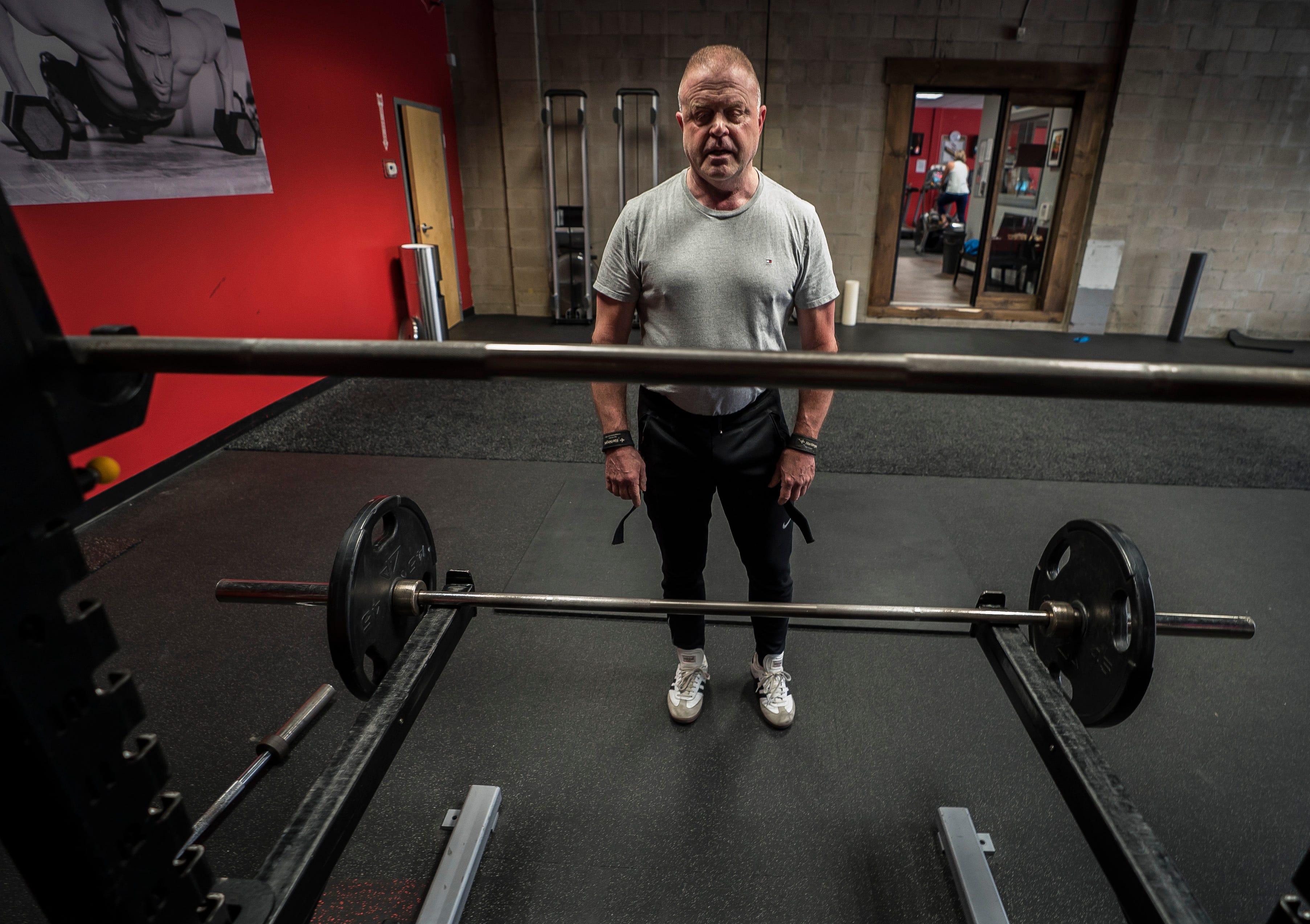 Michael Lowe finishes his daily workout at Snap Fitness in Berlin on Tuesday morning, April 30, 2019. Lowe's struggles with addiction exploded into the public's view in 2009 while serving at the Vergennes Police Chief. After years of struggling with opioid addiction that led to Lowe abusing other drugs as well as alcohol, he says he's finally in a healthy place and now works with people suffering from mental health issues.