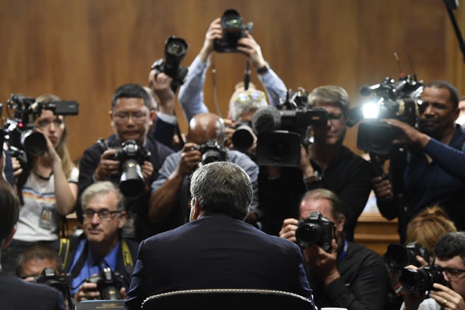 Attorney General William Barr is photographed as he sits down to testify before the Senate Judiciary Committee on Capitol Hill in Washington, Wednesday, May 1, 2019.  (AP Photo/Susan Walsh)