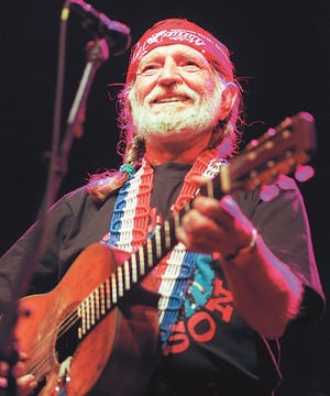 Willie Nelson gives a big smile to his San Angelo fans at the Bill Aylor Sr. Riverstage in 1997.