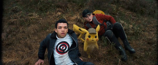 Tim (Justice Smith, left), Pikachu (voiced by Ryan Reynolds), and Lucy (Kathryn Newton) are on the case in 