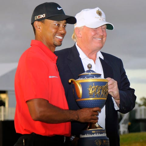 Tiger Woods holds his trophy for winning the WGC...