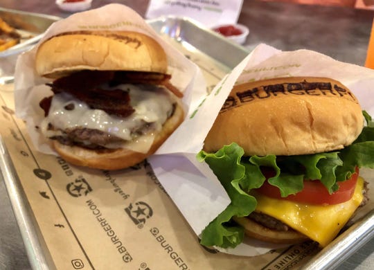 The CEO, rear, and a classic BurgerFi cheeseburger from the recently reopened store in San Carlos Park.