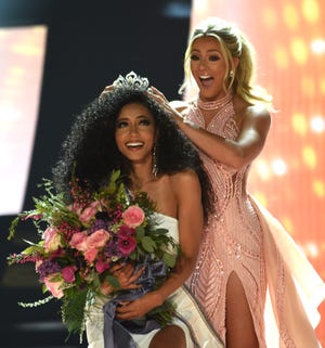 Miss North Carolina Cheslie Kryst gets crowned by last year's winner Sarah Rose Summers after winning the 2019 Miss USA final competition in the Grand Theatre in the Grand Sierra Resort in Reno on May 2, 2019.