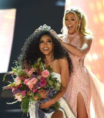 Miss North Carolina Chelsie Kryst is crowned by last year's winner Sarah Rose Summers after winning Miss USA 2019 in Reno, Nev.
