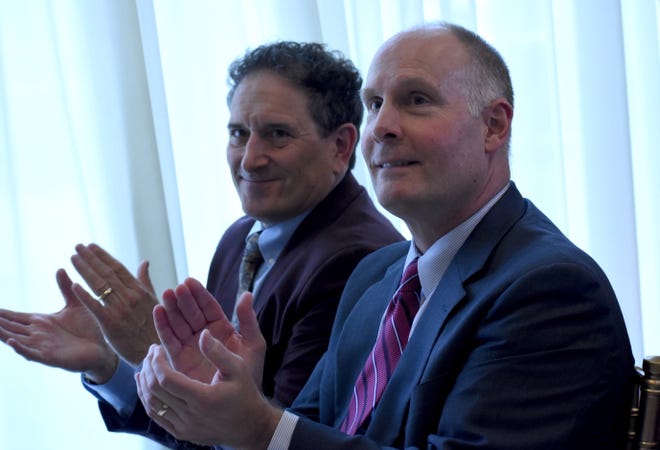 U.S. Rep. Andy Levin, left, D-District 9, and U.S. Rep. John Moolenaar, R-District 4, applaud one of the speakers during a press conference announcing a bi-partisan bill they cowrote that would provide a 2-year period of relief to Iraqi nationals facing deportation on May 3, 2019.  The bill would allow time for Iraqi nationals' cases to be heard in the courts.