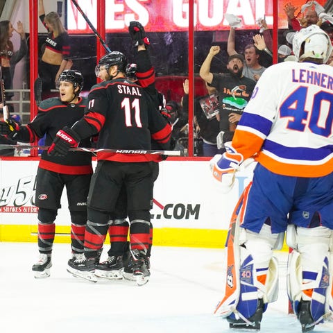 The Hurricanes celebrate a power-play goal by...