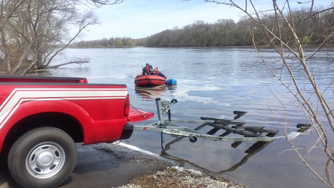 St. Cloud firefighters retrieve a kayak from the Mississippi River at about 12:05 p.m. Sunday, May 5 after reports two people overturned their kayaks near the Sauk Rapids bridge.