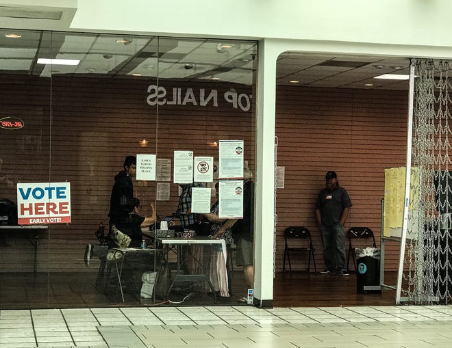 Voters check in at the Basset Place polling site.