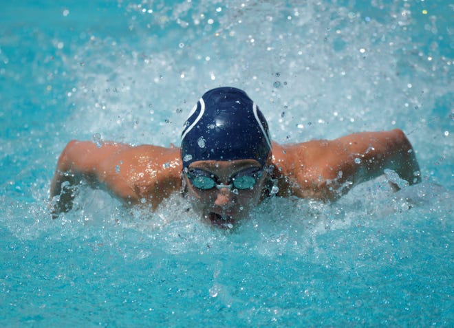 Redwood's Alex Roberts competes in the girls 100-yard butterfly on Saturday at the Central Section swimming championships at Clovis West High School.