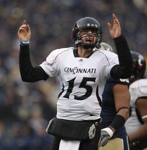 DECEMBER 5, 2009. University of Cincinnati quarterback Tony Pike celebrates his game winning touchdown to Armon Binns against the University of Pittsburgh during the fourth quarter of their game played at Heinz Field in Pittsburgh, Pennsylvania Saturday December 5, 2009.