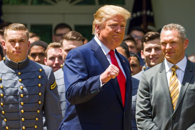 President Donald Trump pumps his fist as he departs after the presentation of the Commander-in-Chief's Trophy to the U.S. Military Academy at West Point football team, in the Rose Garden of the White House, Monday, May 6, 2019, in Washington. (AP Photo/Alex Brandon)