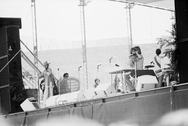 Chicago performing on stage at Hughes Stadium in July 1975.