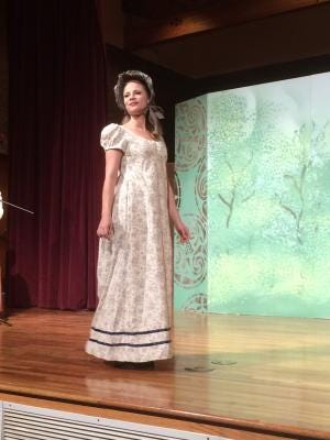 A Regency Dress on display at a performance of The Great American Fashion Show at the New Mexico Farm & Ranch Heritage Museum.