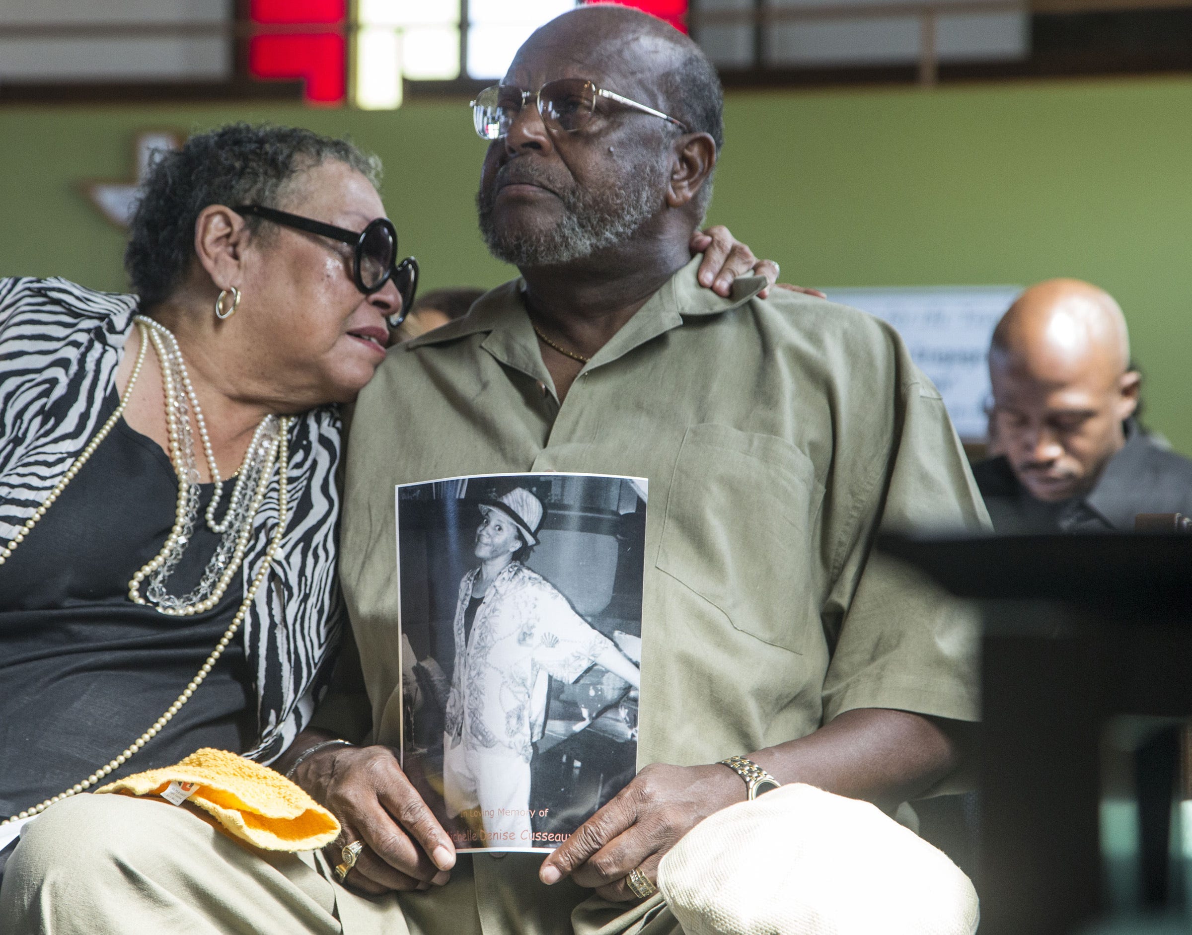 Toni Linyard and Freddie Bell, aunt and uncle of deceased Michelle Cusseaux, gathered for funeral services at Emmanuel Church Of God In Christ in Phoenix, Ariz., on Aug. 23, 2014. Cusseaux, a mentally ill Phoenix woman, was slain by Phoenix police.