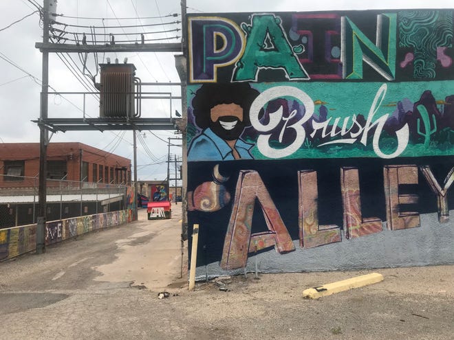 A sign introduces Paintbrush Alley in the 200 block of Irving Street.