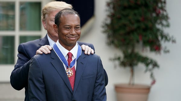 Golfer Tiger Woods was honored by Donald Trump in...