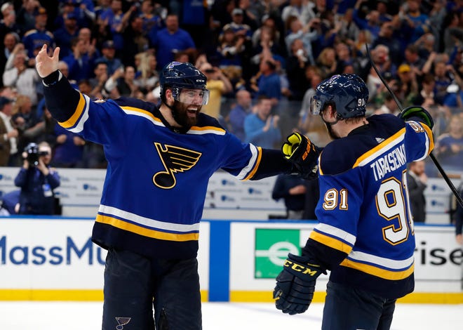 Blues left wing Pat Maroon, left, and right wing Vladimir Tarasenko celebrate the team's 2-1 win against the Dallas Stars in Game 7 on Tuesday.