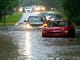 Vehicles wade through flooded Kingwood Drive as thunderstorms hit the Kingwood area, May 7, 2019, in Kingwood, Texas. More rain is in the local forecast for the coming days.