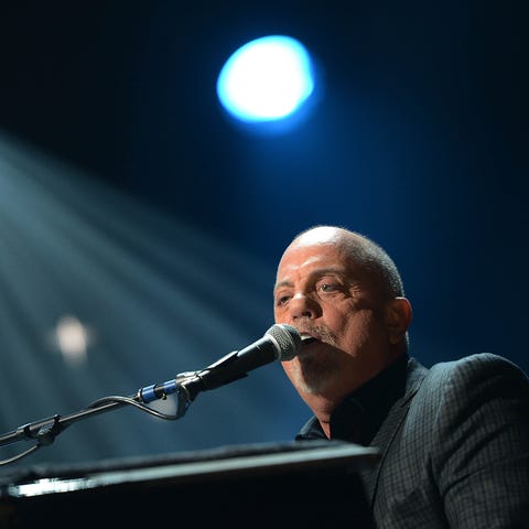 Billy Joel performs at "12-12-12" a concert benefi