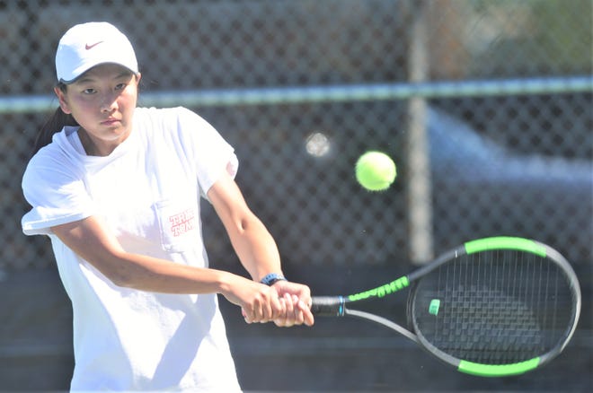 Abilene High sophomore Ruth Hill returns a shot during practice May 8 at the AHS tennis courts. Hill will compete in girls singles at the Class 6A state tournament Thursday in College Station.