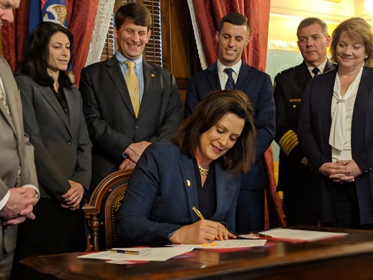Michigan Gov. Gretchen Whitmer signs civil asset forfeiture reform laws on May 9, 2019. During the ceremony, she threatened to veto Senate-approved and House-passed no-fault auto insurance legislation unless there were changes.