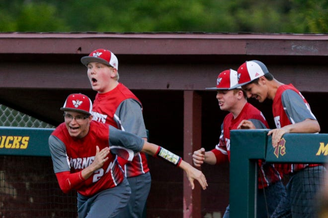 The Rossville dugout clears as they celebrate defeating McCutcheon, 7-6, Wednesday, May 8, 2019, at McCutcheon High School in Lafayette.