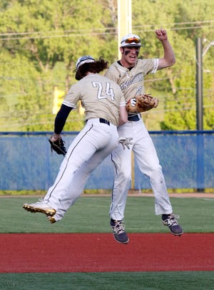 Lancaster's Casey Finck and Wes Ward celebrate after clinching the Ohio Capital Conference-Ohio Division last season, marking the second consecutive year the Golden Gales won the conference championship.