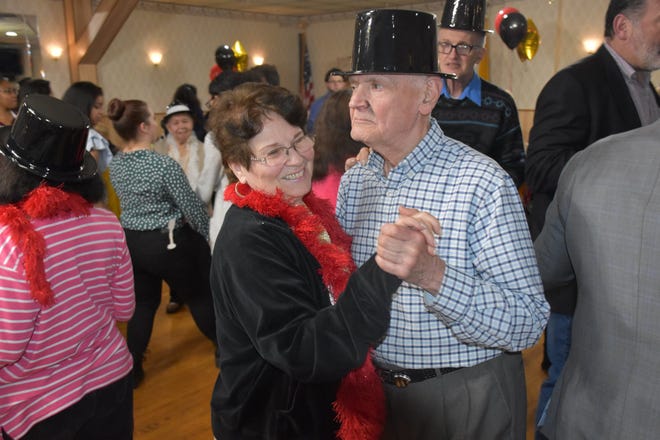 An unidentified New Jersey couple dance during a senior citizen prom in 2019.