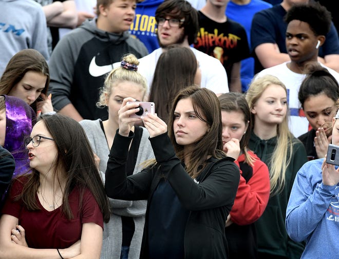 Dover High School junior Emily Shoemaker photographs a mock accident scene at the Dover Area High School Thursday, May 9, 2019. Local fire, ambulance and police volunteered for the event which reminds high school upperclassmen to be safe during prom season. Dover's prom in Saturday, May 11. Bill Kalina photo                       