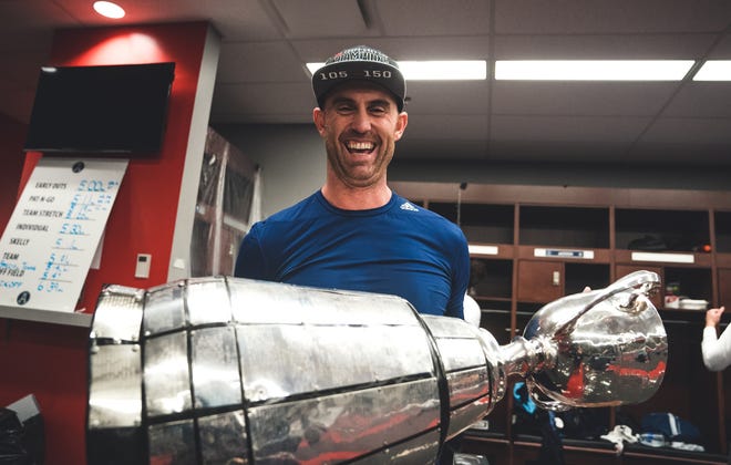 Toronto QB Ricky Ray poses with the Grey Cup after winning the championship game in Ottawa on Sunday, November 26, 2017.