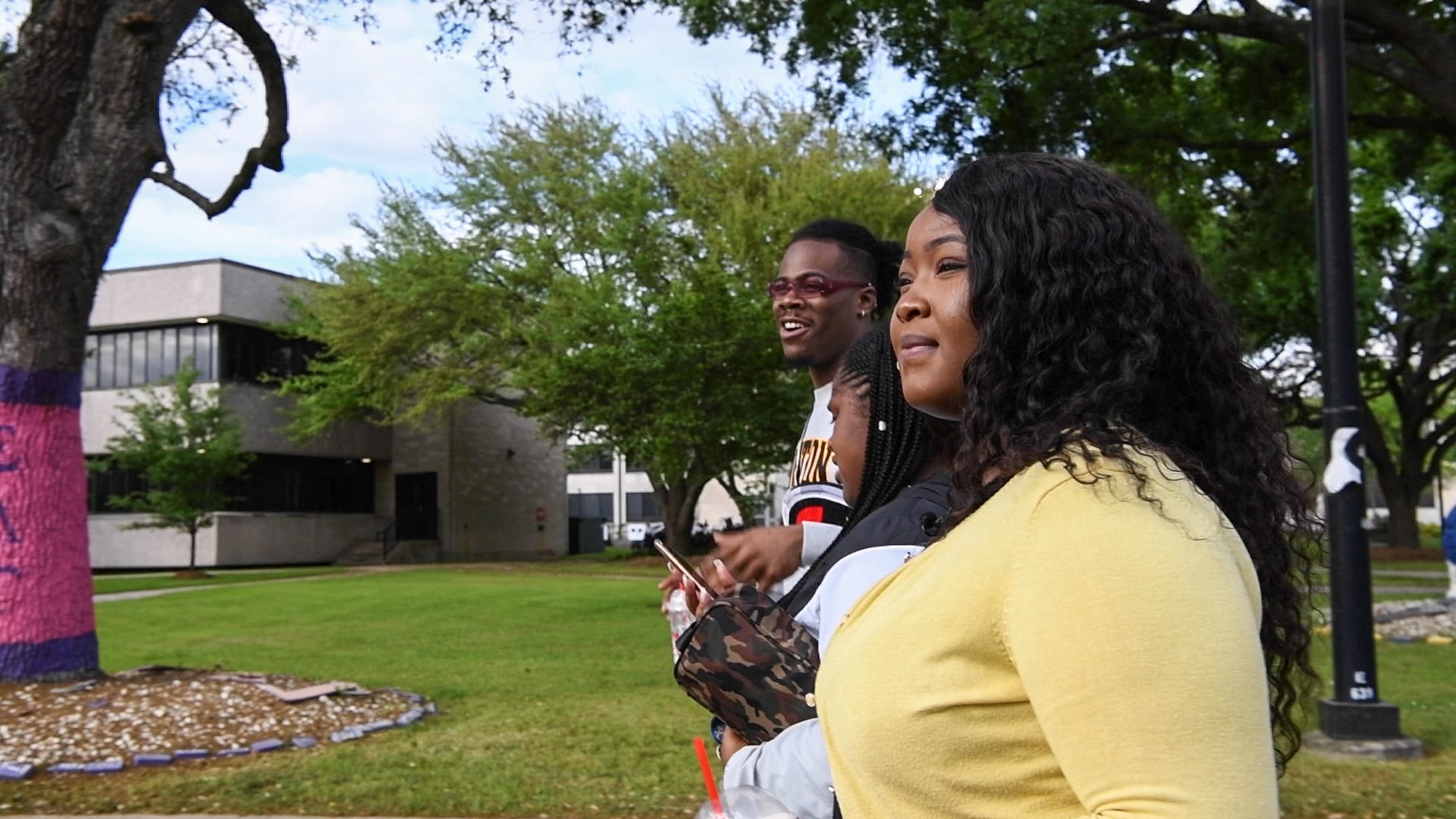 Itivere Enaohwo, right, walks with friends on the campus of Texas Southern University.