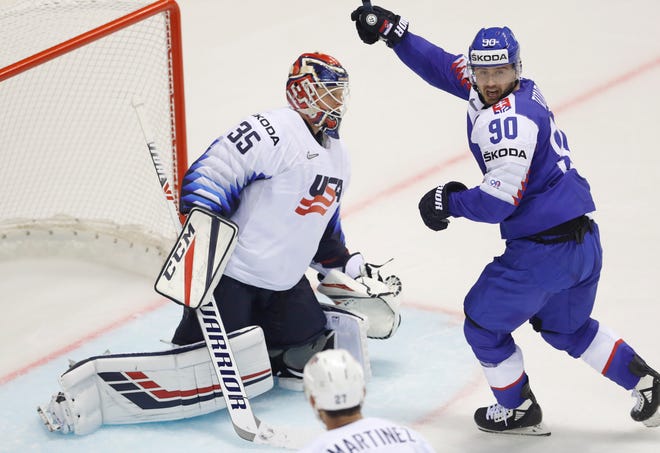 Slovakia's Tomas Tatar, a former Red Wing, celebrates his goal past goaltender Cory Schneider of the United States.