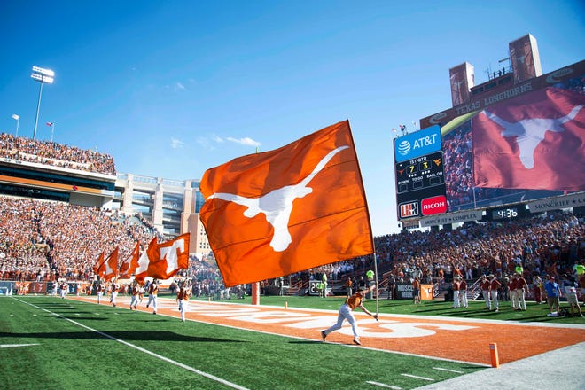 Nov 3, 2018; Austin, TX, USA; Texas Longhorns cheerleaders run flags down the field after the Texas Longhorns score a touchdown during the first quarter against the West Virginia Mountaineers at Darrell K Royal-Texas Memorial Stadium. Mandatory Credit: Bethany Hocker-USA TODAY Sports