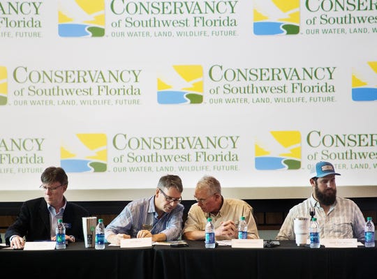 U.S Rep. Francis Rooney speaks with Rob Moher at public meeting about water quality issues at the Conservancy of Southwest Florida in Naples on Friday May 10, 2019. The meeting was held with water quality stakeholders and water quality advocates. Moher is the president of the Conservancy. On the left is Greg Tolley, Professor of Marine Science at FGCU. On the right is Capt. Daniel Andrews, founder of Captains for Clean Water. 