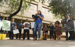 Nicole Hale leads during a protest against cash bail at the Maricopa County Attorney's office in Phoenix on May 9, 2019.