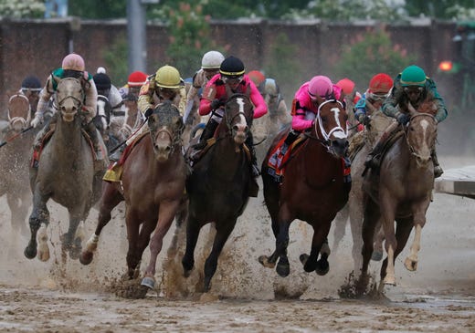 Flavien Prat on Country House, second from left, races against Luis Saez on Maximum Security, fourth from left, during the 145th running of the Kentucky Derby horse race at Churchill Downs, May 4, 2019, in Louisville, Ky. Maximum Security was disqualified and Country House won the race. 