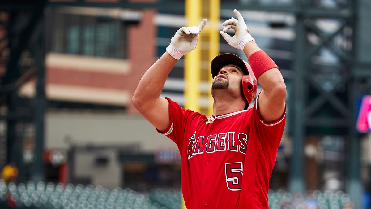Angels first baseman Albert Pujols celebrates after hitting a home run for his 2,000th RBI in the third inning against the Tigers.