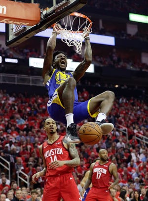 Warriors forward Jordan Bell (2) scores over Rockets guard Gerald Green during the first half of Game 6 on Friday.