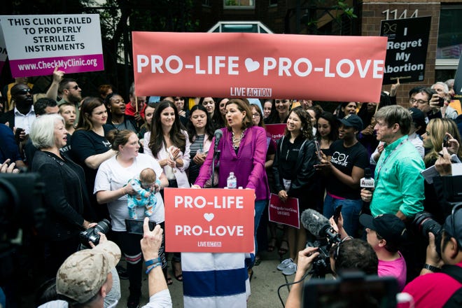 Ashley Garecht speaks as anti-abortion protesters rally near a Planned Parenthood clinic in Philadelphia, Friday, May 10, 2019.