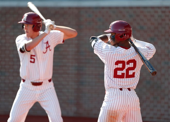 Alabama freshmen TJ Reeves (22) and Tyler Ras (5) prepare to hit during a Southeastern Conference game against LSU on April 27, 2019 from Sewell-Thomas Stadium in Tuscaloosa. (Photo by Austin Bigoney/Alabama athletics)