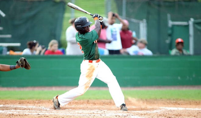 FAMU outfielder Willis McDaniel gets a base hit against North Carolina A&T in Greensboro. The Rattlers dropped two of three in the series to finish the regular season in second place in the MEAC Southern Division.