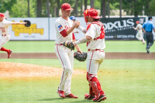 UL seniors Gunner Leger, left, and Handsome Monica, right, celebrate the win after Sunday's 11-5 Senior Day win over Georgia State.