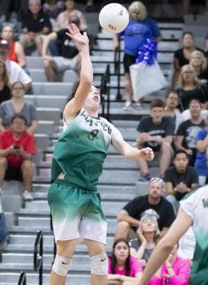 Junior outside hitter Jesse Lowder (9) of the Campo Verde Coyotes hits during the 5A Boys Volleyball State Championships against the Tucson Mountain View Mountain Lions at Higley High School on Saturday, May 11, 2019 in Gilbert, Arizona.