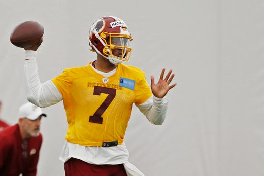 Washington Redskins quarterback Dwayne Haskins Jr. passes the ball during drills as part of rookie minicamp at Redskins Park.