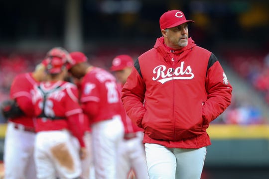 Cincinnati Reds manager Bryan Price (38) walks back to the dugout after a pitching change in the eighth inning during the National League baseball game between the Chicago Cubs and the Cincinnati Reds, Monday, April 2, 2018, at Great American Ball Park in Cincinnati. The Cincinnati Reds won 1-0.