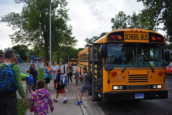 Children get off of a bus at the new Sonia Sotomayor Elementary School in Sioux Falls in this file photo. While Sioux Falls maintains the traditional five-day school week, 23 percent of schools in the state are have a four-day school week.