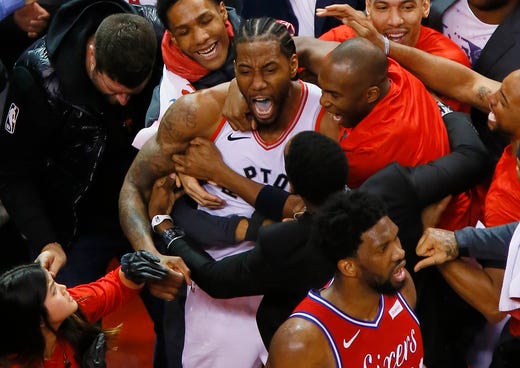 May 12: Kawhi Leonard celebrates after sinking a wild buzzer-beater to lift the Raptors over the Sixers in Game 7 and send Toronto to the Eastern Conference finals.