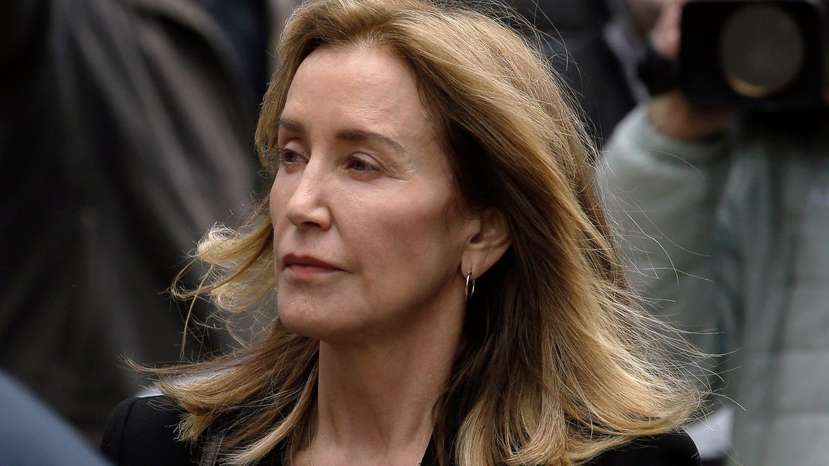 Felicity Huffman arrives at federal court Monday, May 13, 2019, in Boston, where she is scheduled to plead guilty to charges in a nationwide college admissions bribery scandal.